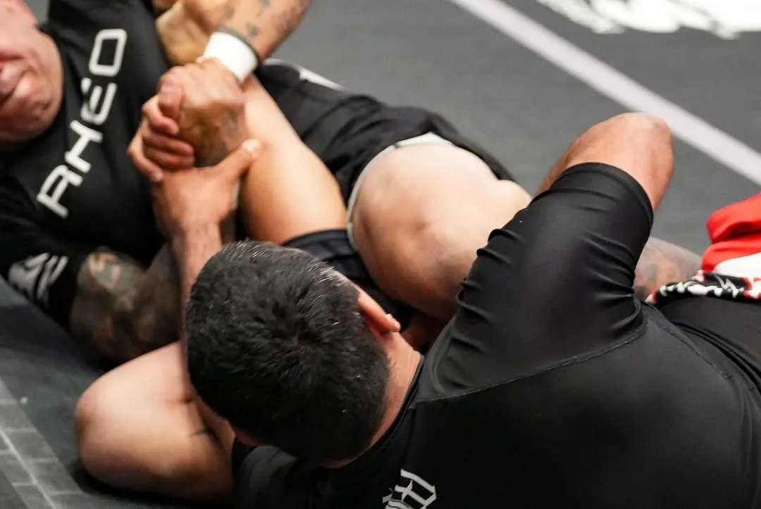 A member practicing a self-defense Brazilian Jiu-Jitsu position at AOE in Monterey
