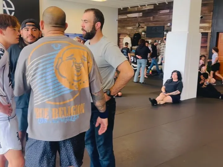 An adult beginner training No-Gi Brazilian Jiu-Jitsu in a class at AOE in Monterey